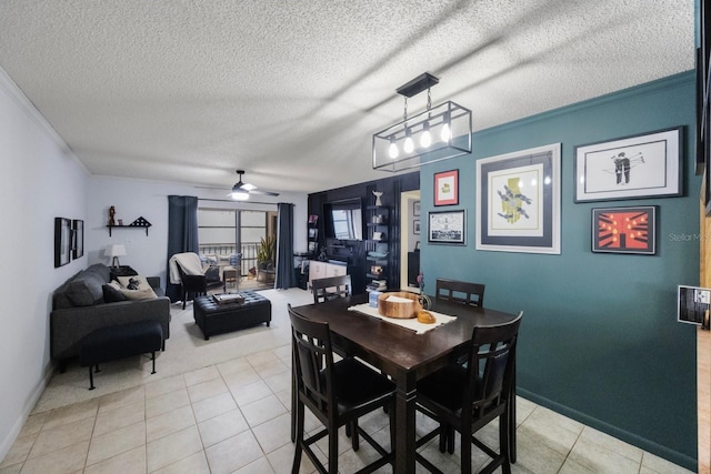 dining area with ceiling fan, light tile patterned flooring, and crown molding