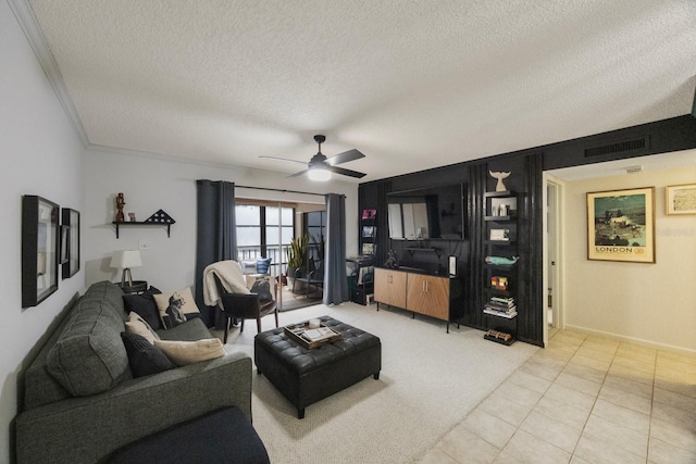 living area featuring visible vents, ceiling fan, a textured ceiling, and light tile patterned floors