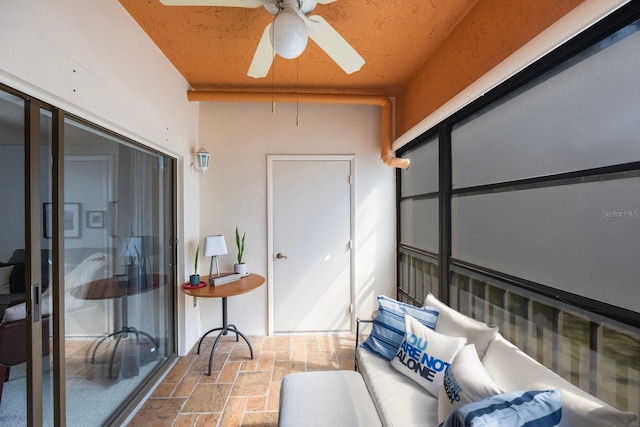 sunroom with a ceiling fan