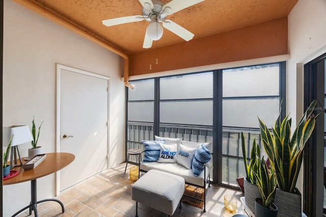 sunroom / solarium with ceiling fan