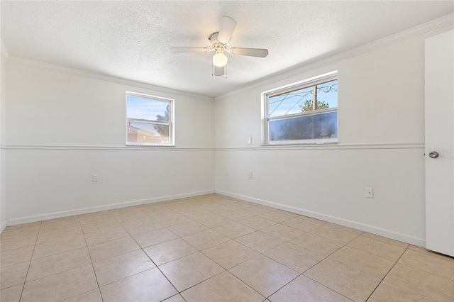 unfurnished room featuring a healthy amount of sunlight, ceiling fan, a textured ceiling, and crown molding