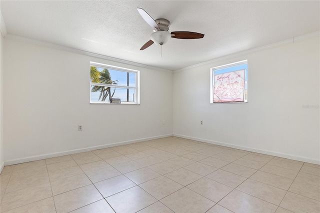 unfurnished room featuring a textured ceiling, baseboards, and crown molding