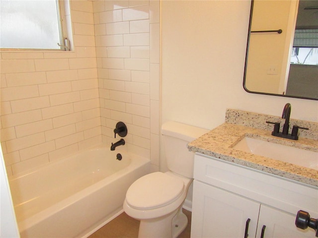 bathroom featuring toilet, plenty of natural light, bathing tub / shower combination, and vanity