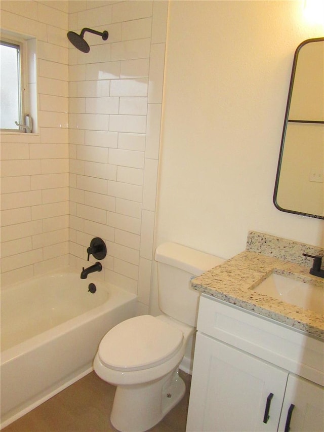 bathroom featuring toilet, shower / bath combination, and vanity