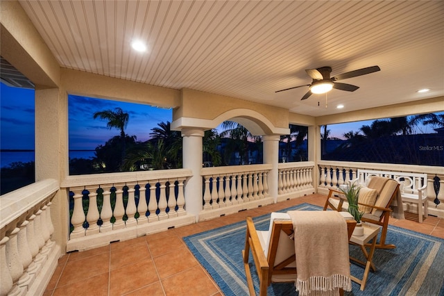 view of patio featuring outdoor dining area and ceiling fan