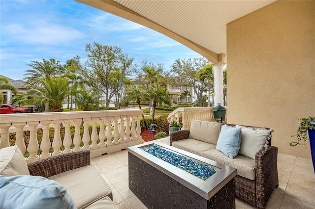 view of patio / terrace featuring an outdoor living space with a fire pit