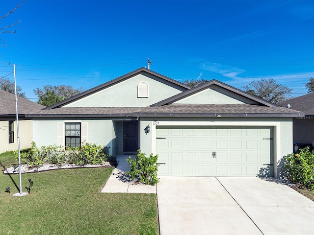 ranch-style home featuring a front yard, roof with shingles, stucco siding, concrete driveway, and a garage