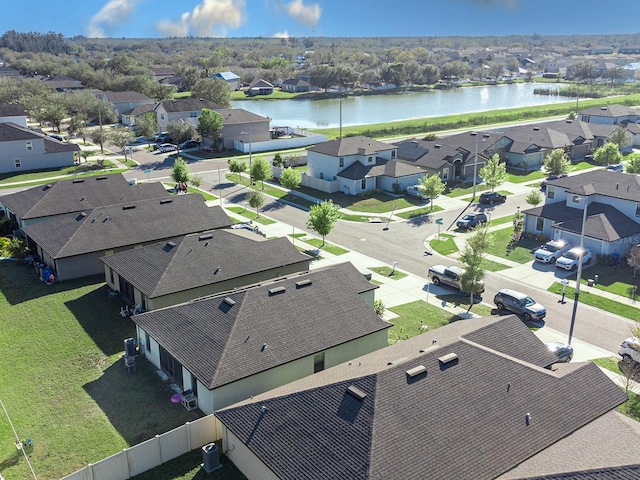 bird's eye view featuring a residential view and a water view