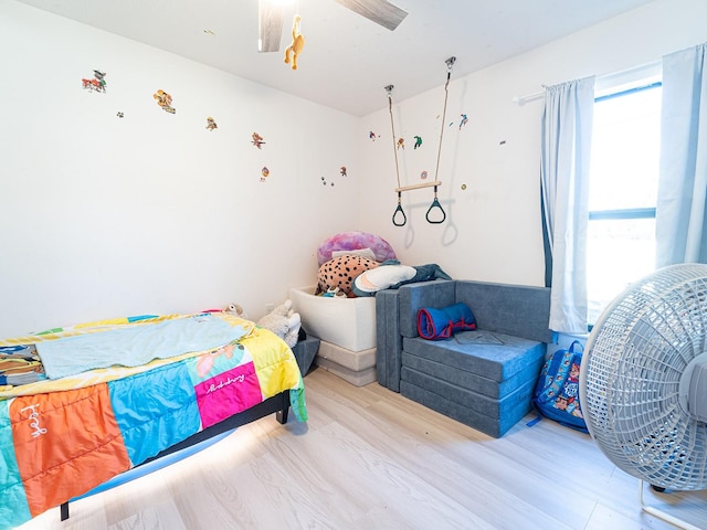 bedroom featuring wood finished floors and a ceiling fan