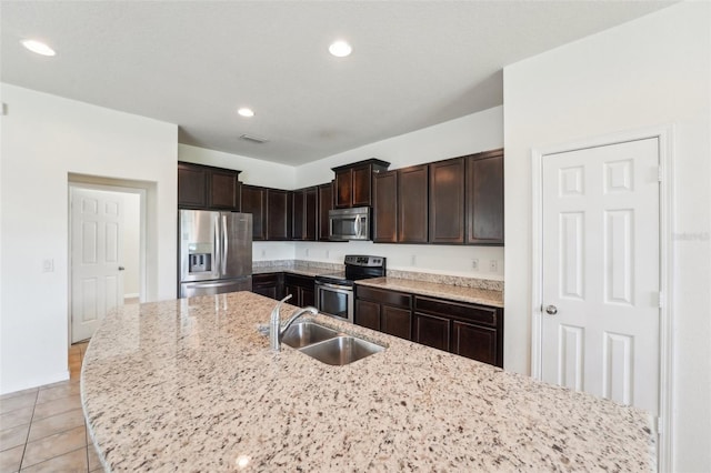 kitchen featuring a sink, dark brown cabinets, recessed lighting, and stainless steel appliances