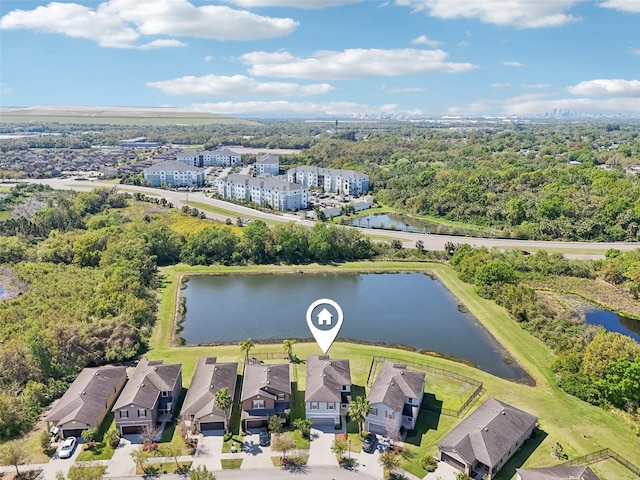 birds eye view of property featuring a residential view and a water view