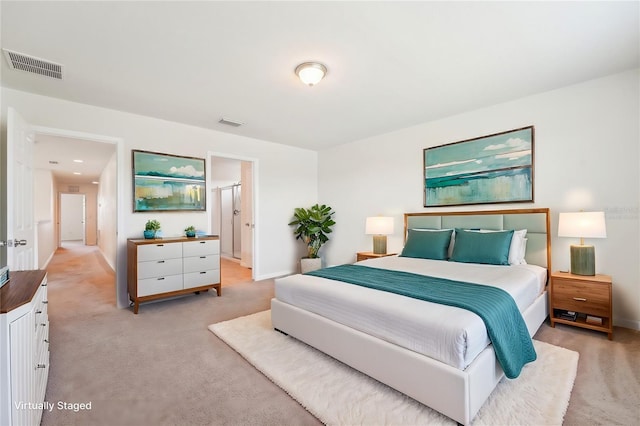 bedroom featuring visible vents, baseboards, and light colored carpet