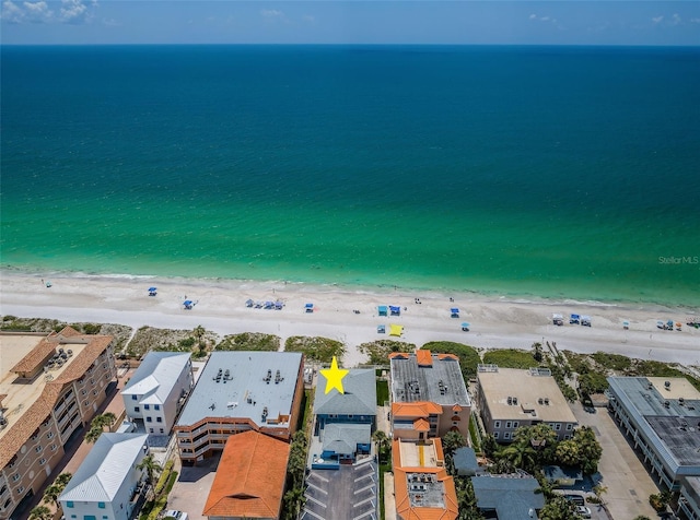 bird's eye view featuring a view of the beach and a water view