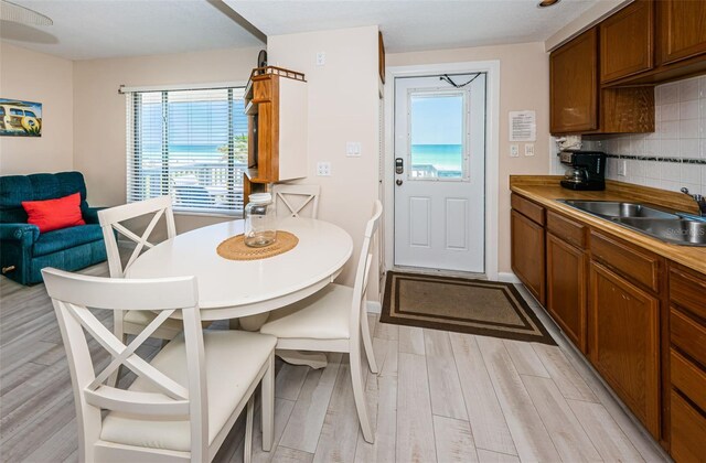 dining area with light wood-style flooring