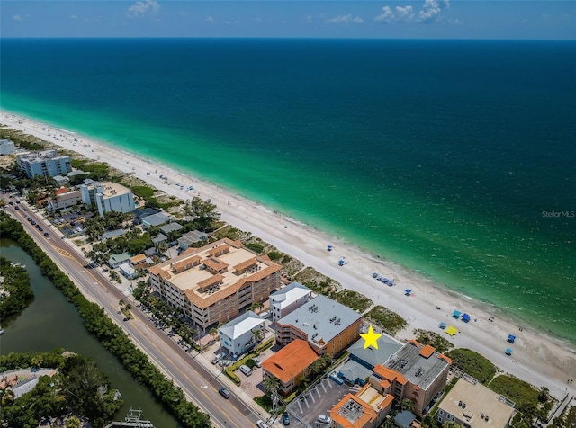 aerial view featuring a water view and a beach view