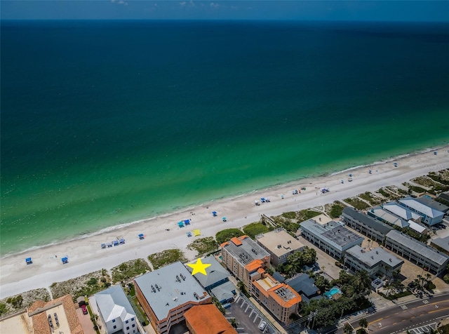 aerial view with a water view and a beach view