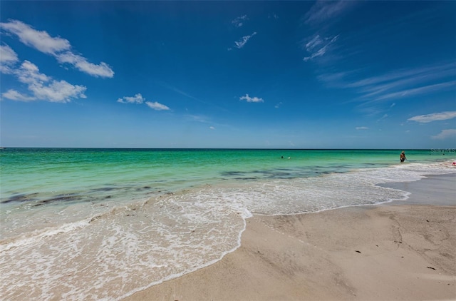 property view of water featuring a beach view