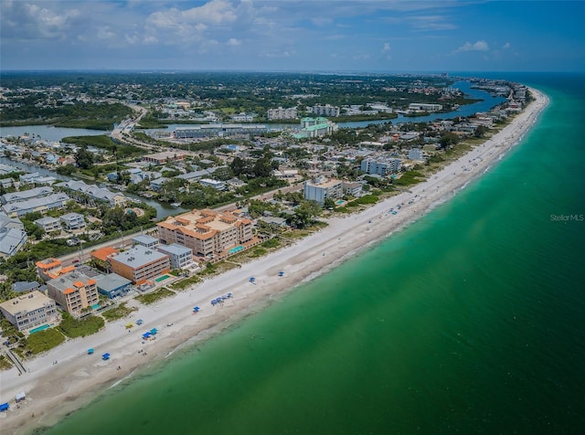 birds eye view of property featuring a view of the beach, a water view, and a view of city