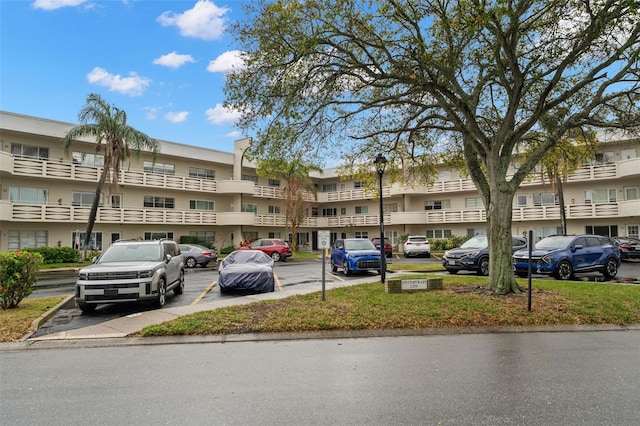 view of property with uncovered parking