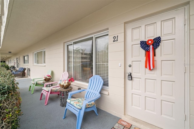 doorway to property with covered porch