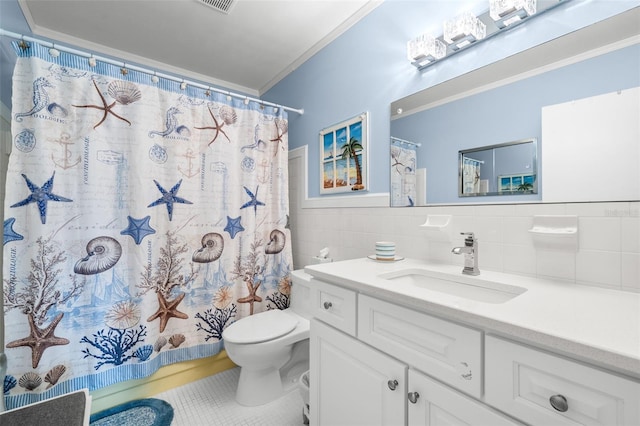 full bath featuring tile walls, toilet, ornamental molding, vanity, and tile patterned floors