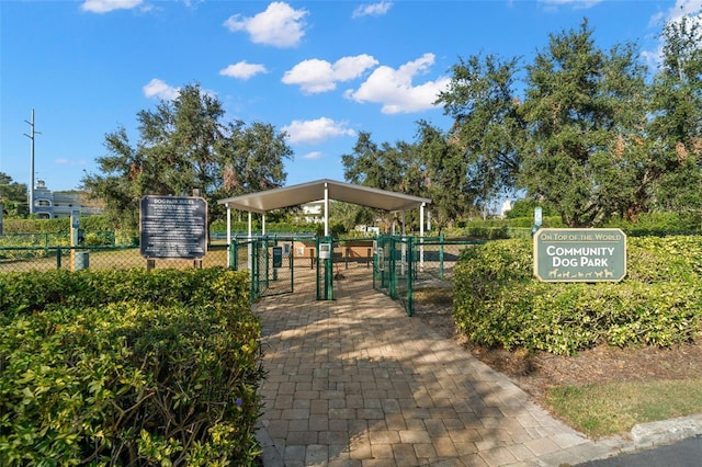 view of property's community with a gate and fence