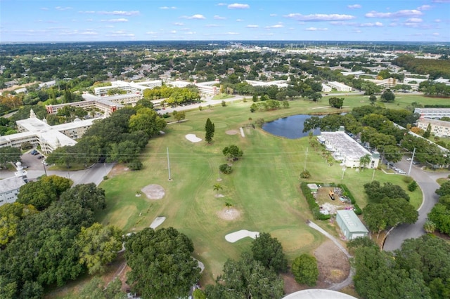 bird's eye view with a water view and view of golf course