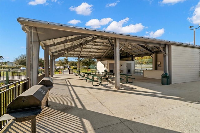 view of community with a patio, a gazebo, and fence