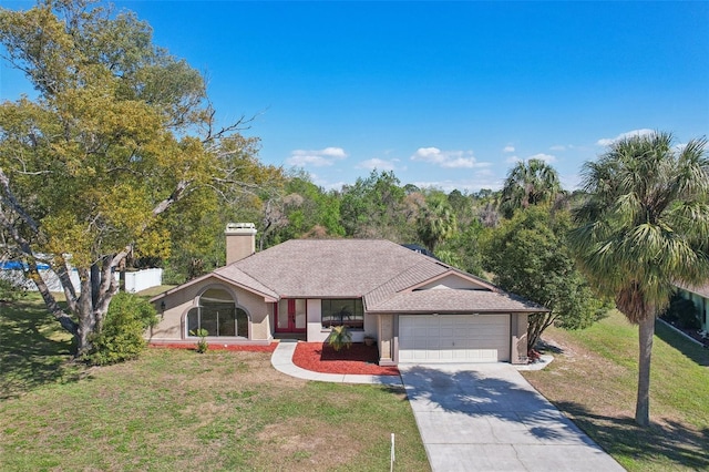 ranch-style home with driveway, roof with shingles, a front yard, a garage, and a chimney