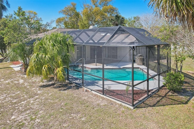 outdoor pool featuring a lanai and a patio