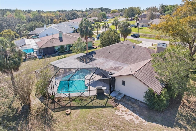 birds eye view of property with a residential view