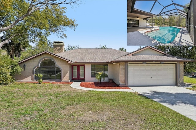 14048 Bruni Dr, Spring Hill, FL 34609 - view of front of property featuring french doors, an attached garage, a front yard, and concrete driveway