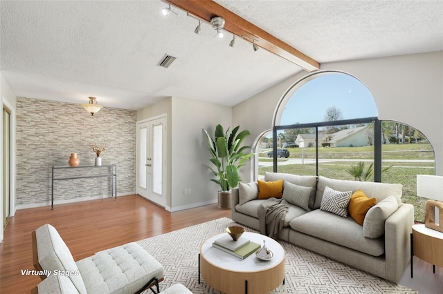 14048 Bruni Dr, Spring Hill, FL 34609 - living room featuring light wood-style floors and a textured ceiling