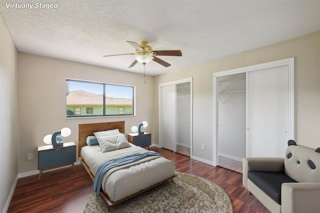 14048 Bruni Dr, Spring Hill, FL 34609 - bedroom featuring two closets, wood finished floors, and ceiling fan