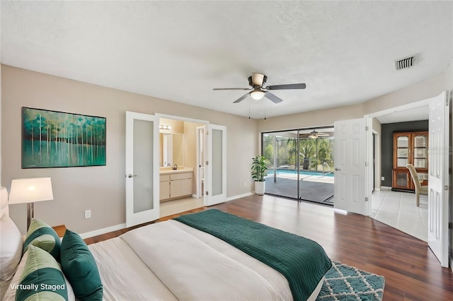 14048 Bruni Dr, Spring Hill, FL 34609 - bedroom with french doors, access to outside, light wood finished floors, and a ceiling fan