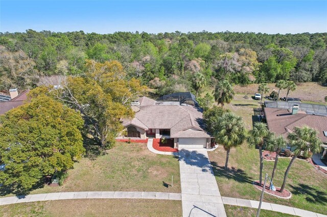 14048 Bruni Dr, Spring Hill, FL 34609 - view from above of property with a heavily wooded area