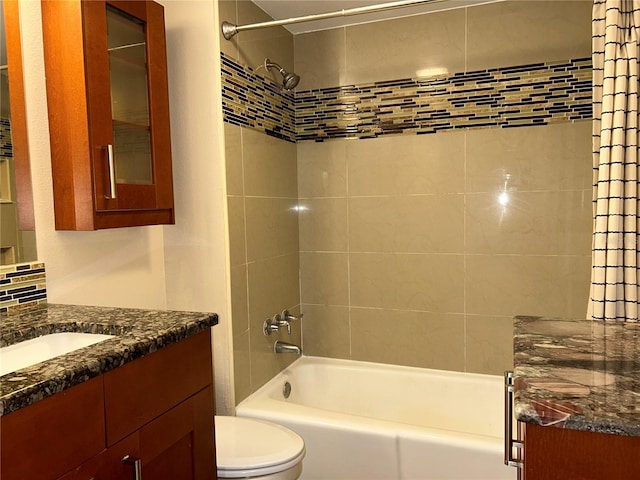 bathroom featuring toilet, bathtub / shower combination, and vanity