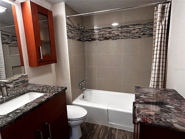 full bathroom featuring vanity, shower / bath combination with curtain, toilet, and wood finished floors