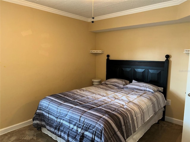 bedroom featuring crown molding, baseboards, and carpet floors