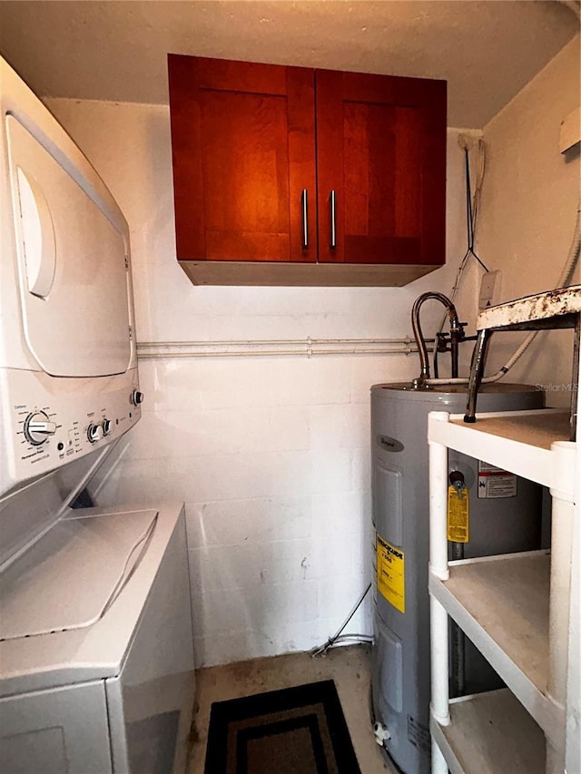 washroom with laundry area, concrete block wall, water heater, and stacked washing maching and dryer