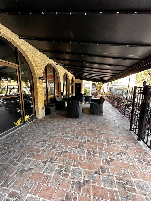 view of patio / terrace featuring fence and an outdoor hangout area