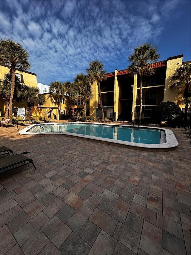 community pool with a patio