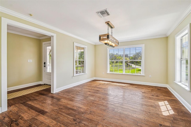 unfurnished dining area featuring visible vents, baseboards, dark wood finished floors, and ornamental molding