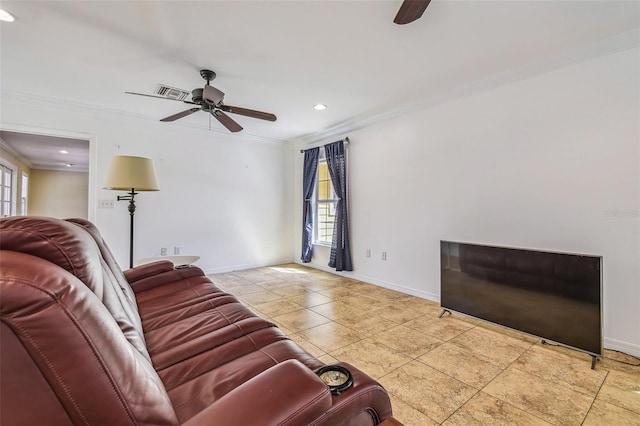 living area featuring visible vents, baseboards, ceiling fan, tile patterned flooring, and ornamental molding