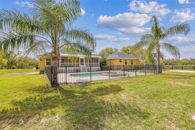 view of swimming pool with a patio area, a fenced in pool, a lawn, and fence