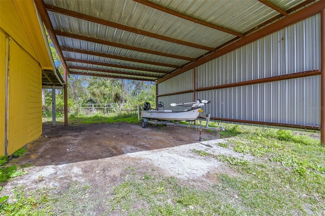 view of parking with an attached carport