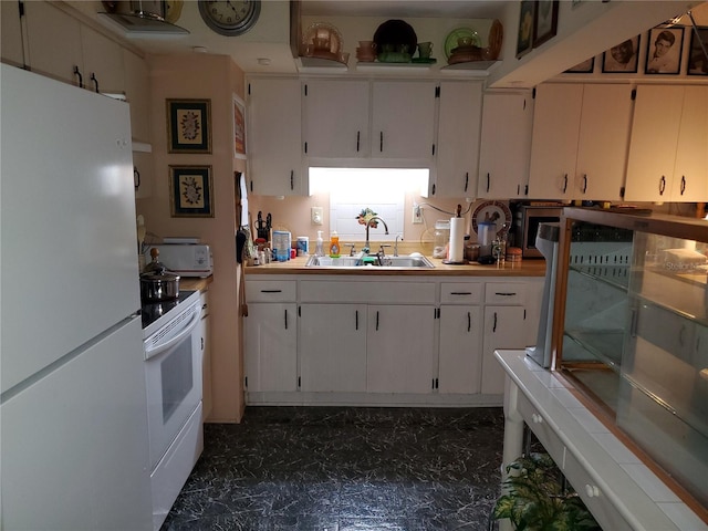 kitchen featuring white appliances, white cabinets, a sink, and light countertops