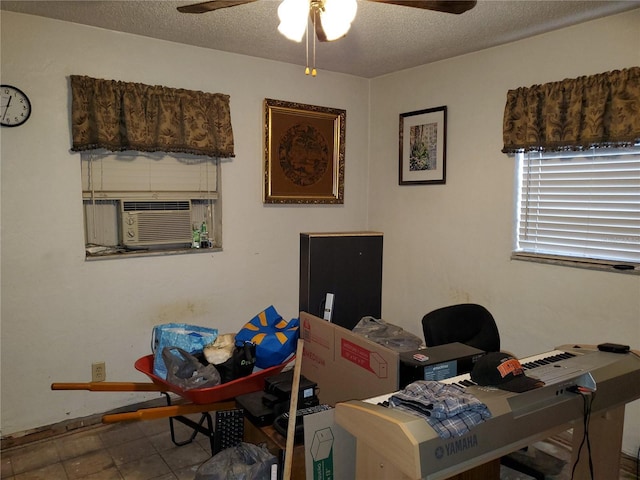 tiled home office featuring a textured ceiling, a ceiling fan, and cooling unit