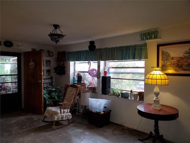 living area featuring concrete floors