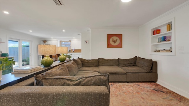 living room featuring recessed lighting, visible vents, built in features, baseboards, and crown molding